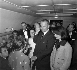 jackie bouvier kennedy onassis with johnson-swearing-in after jfk death on plane.jpg